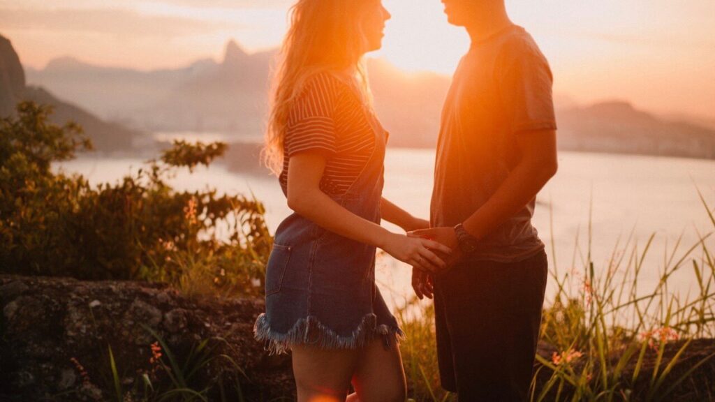 married-couple-looking-each-other-with-sun-set