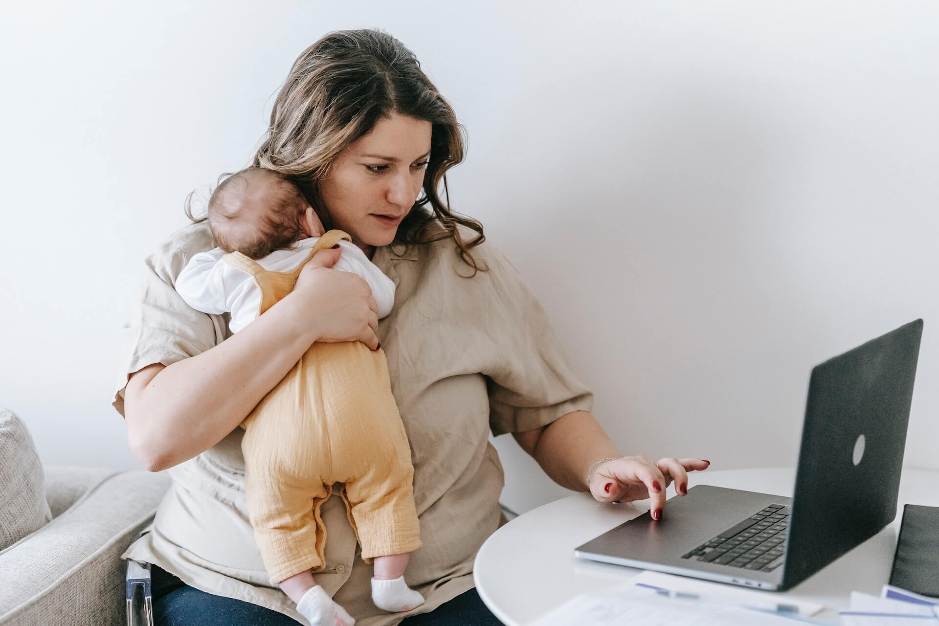 woman-mother-working-with-a-baby
